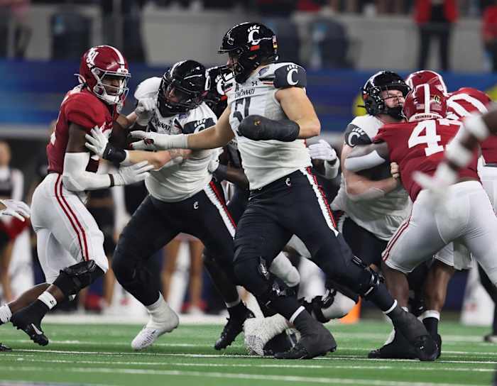 Dec 31, 2021; Arlington, Texas, USA; Cincinnati Bearcats guard Lorenz Metz (51) in action against the the Alabama Crimson Tide during the 2021 Cotton Bowl college football CFP national semifinal game at AT&T Stadium. Mandatory Credit: Matthew Emmons-USA TODAY Sports